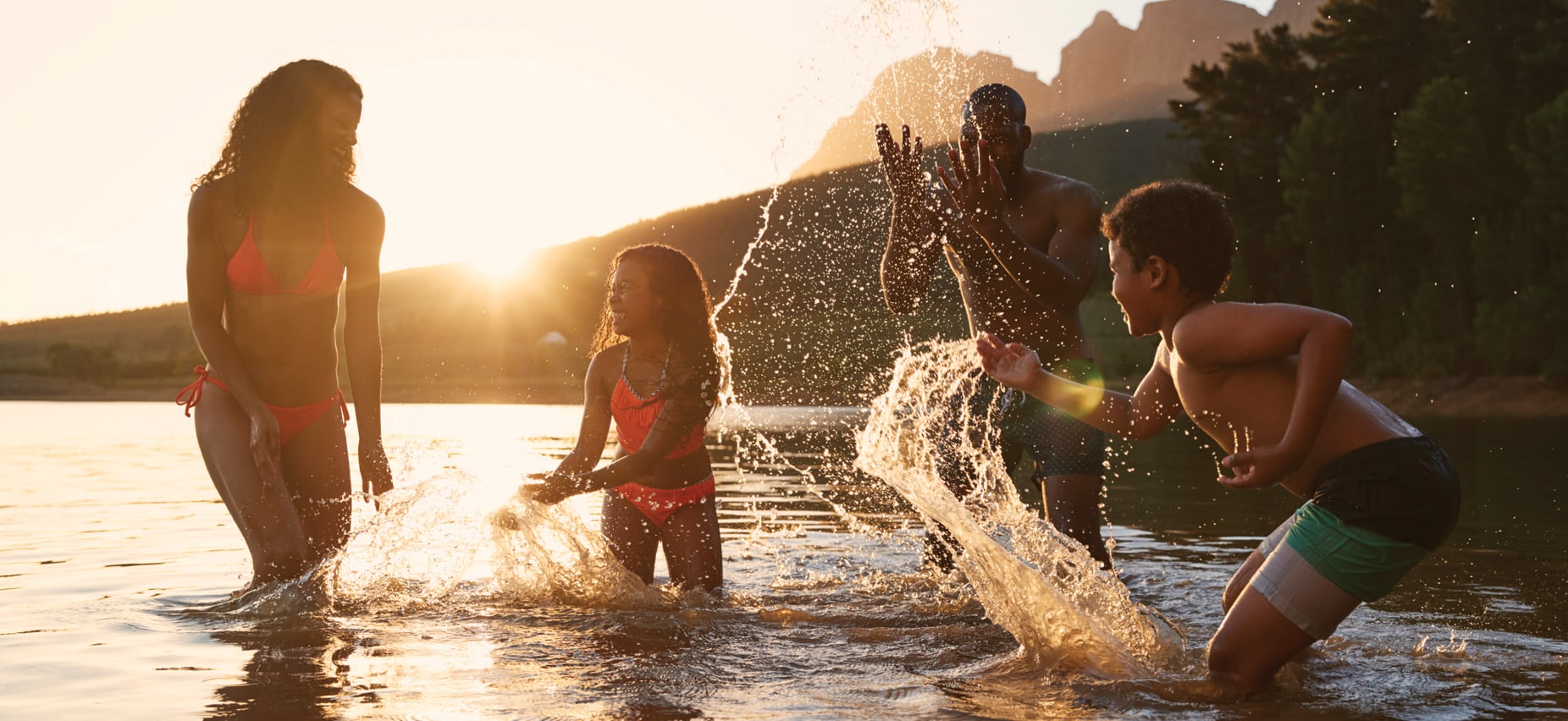 Family playing in water